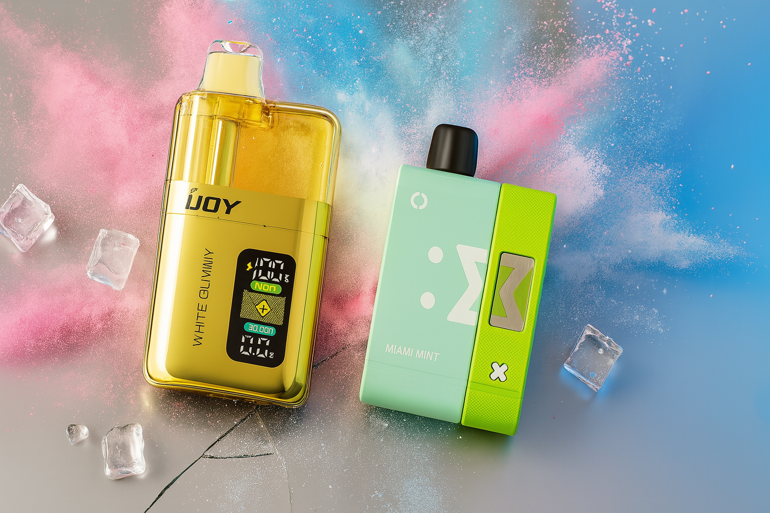 A dramatic product photo shows two vape devices on a cracked, reflective surface with a dynamic, multicolored powder background. The device on the left is a tall, cylindrical gold and red vape with a futuristic, illuminated design on the front. The device on the right is a box-shaped vape that is half purple and half yellow, with a bright digital screen on the yellow side.
