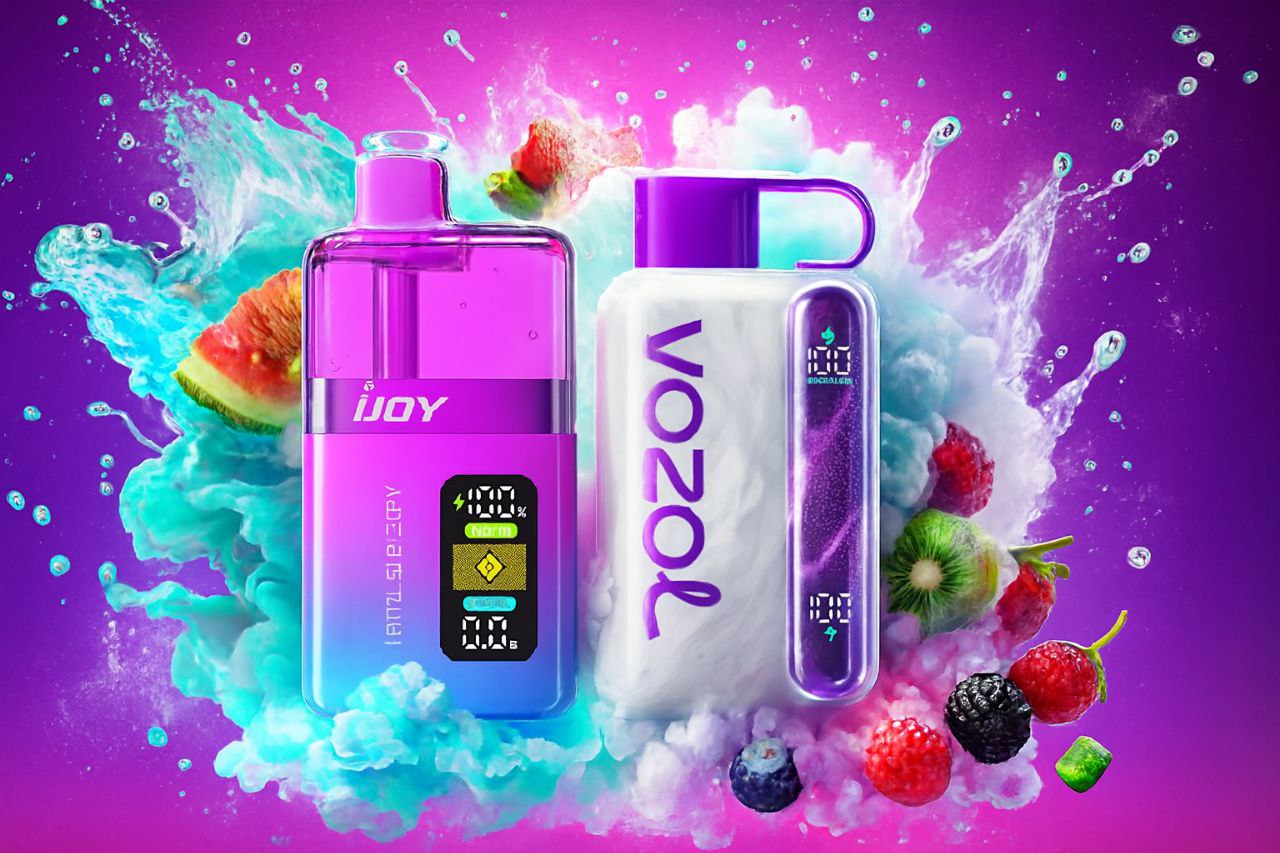 A vibrant product shot of two large disposable vape devices, one pink/blue and one white/purple, set against a bright magenta background. They are flanked by energetic plumes of contrasting teal and pink vapor and water splashes, and surrounded by fresh fruits like kiwi, watermelon, and various berries.